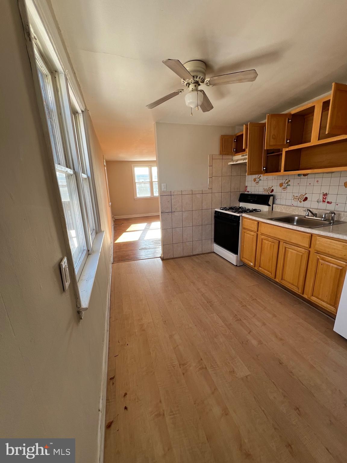 7238 Dungan Road Philadelphia, PA 19111 - Photo 5 of 15 a large kitchen with a sink and dishwasher a stove top oven