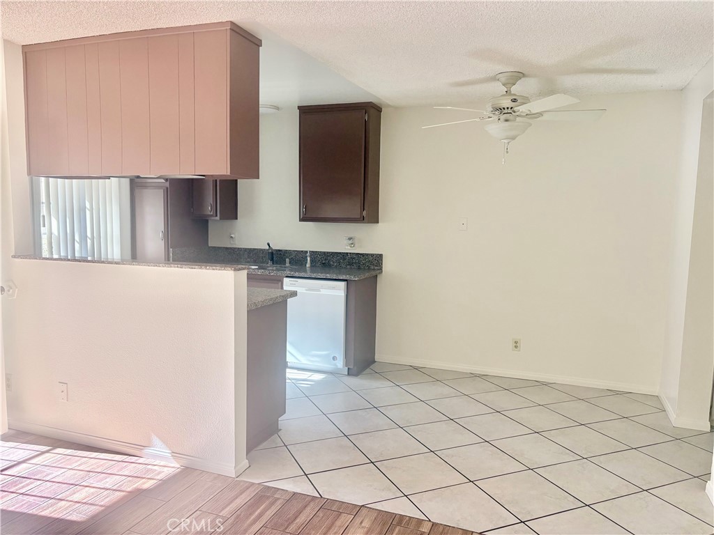 11751 Colima Road, Unit B Whittier, CA 90604 - Photo 10 of 12 a kitchen with white cabinets and sink