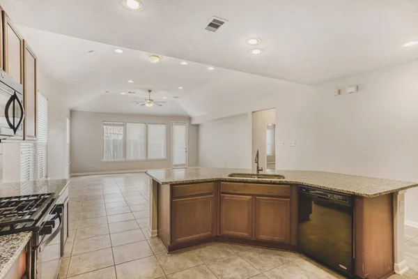 a kitchen with a sink and cabinets