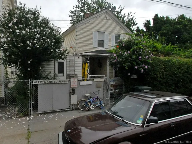 a view of a car park in front of house