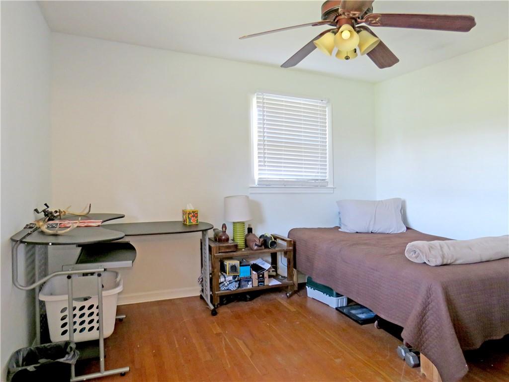 4672 Vernon Drive Southwest Mableton, GA 30126 - Photo 11 of 42 a bedroom with a bed and a chandelier