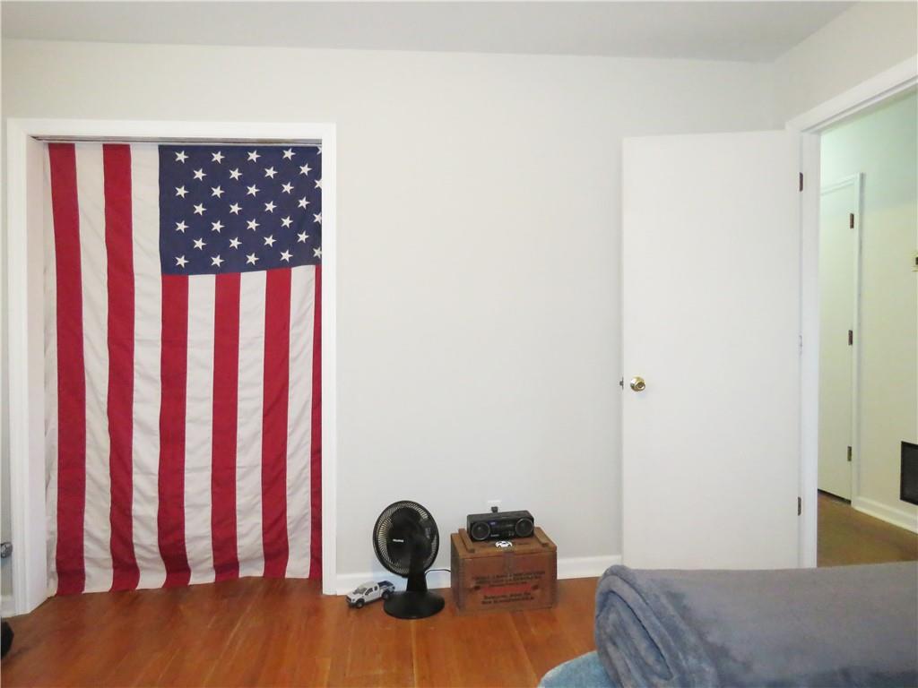 4672 Vernon Drive Southwest Mableton, GA 30126 - Photo 18 of 42 a bedroom with a bed and wooden floor