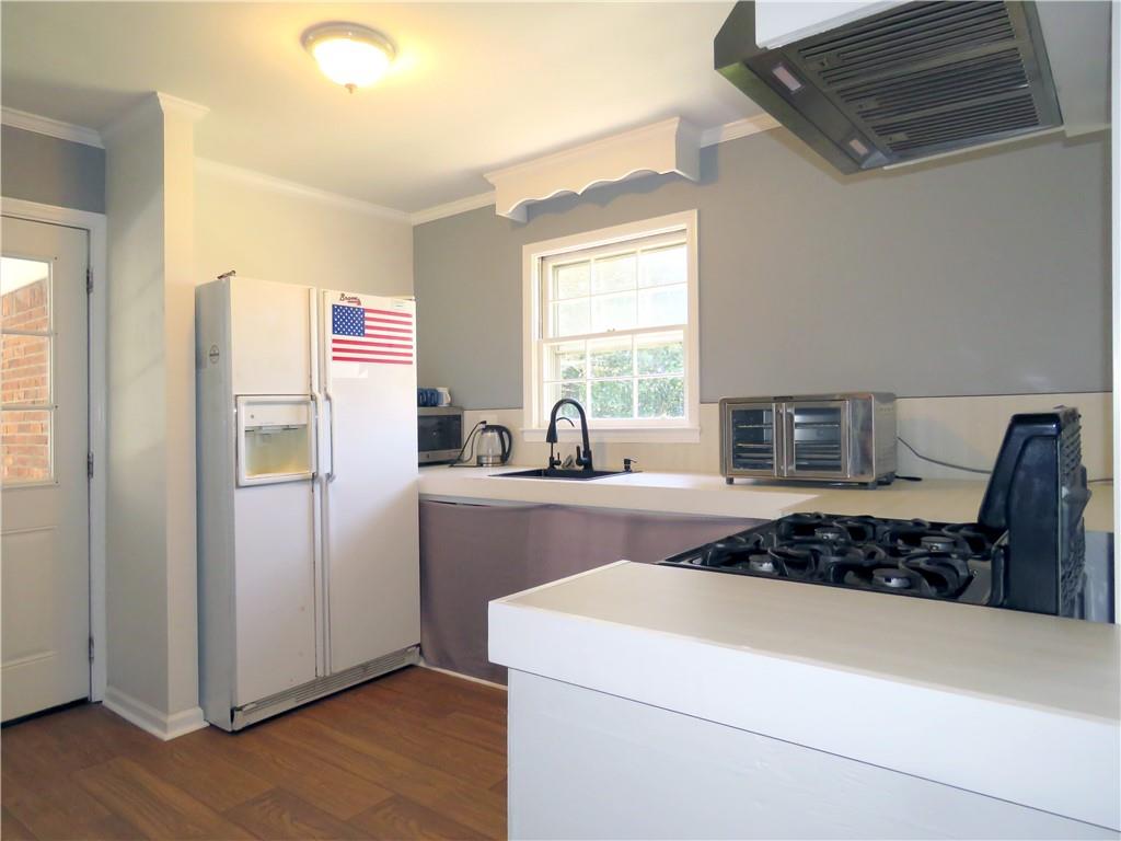 4672 Vernon Drive Southwest Mableton, GA 30126 - Photo 26 of 42 a kitchen with stainless steel appliances granite countertop a refrigerator and a stove