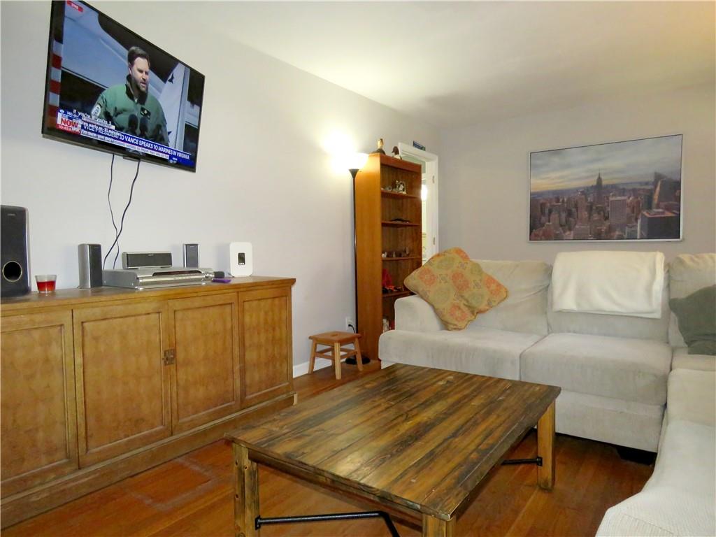 4672 Vernon Drive Southwest Mableton, GA 30126 - Photo 30 of 42 a living room with furniture and a flat screen tv