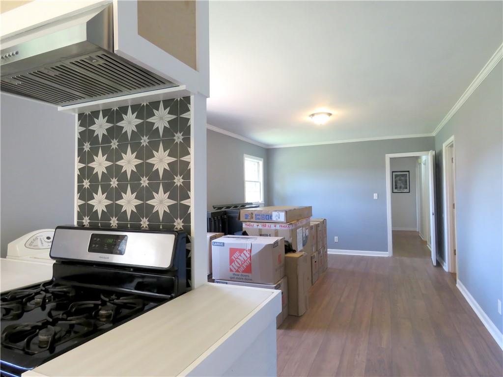 4672 Vernon Drive Southwest Mableton, GA 30126 - Photo 3 of 42 a kitchen with a stove and a wooden floor
