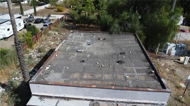 a view of a backyard with sitting area