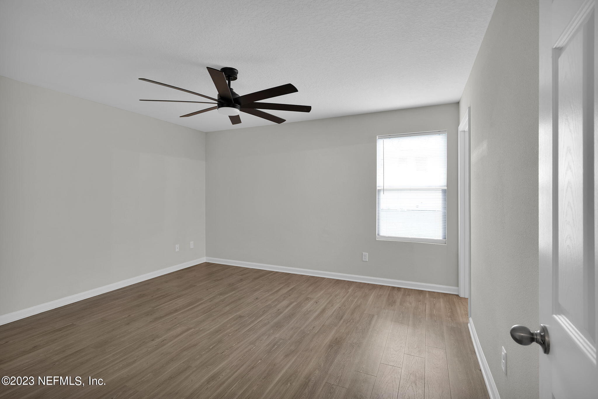 3082 Jennings Road Jacksonville, FL 32218 - Photo 14 of 17 wooden floor in an empty room with a window