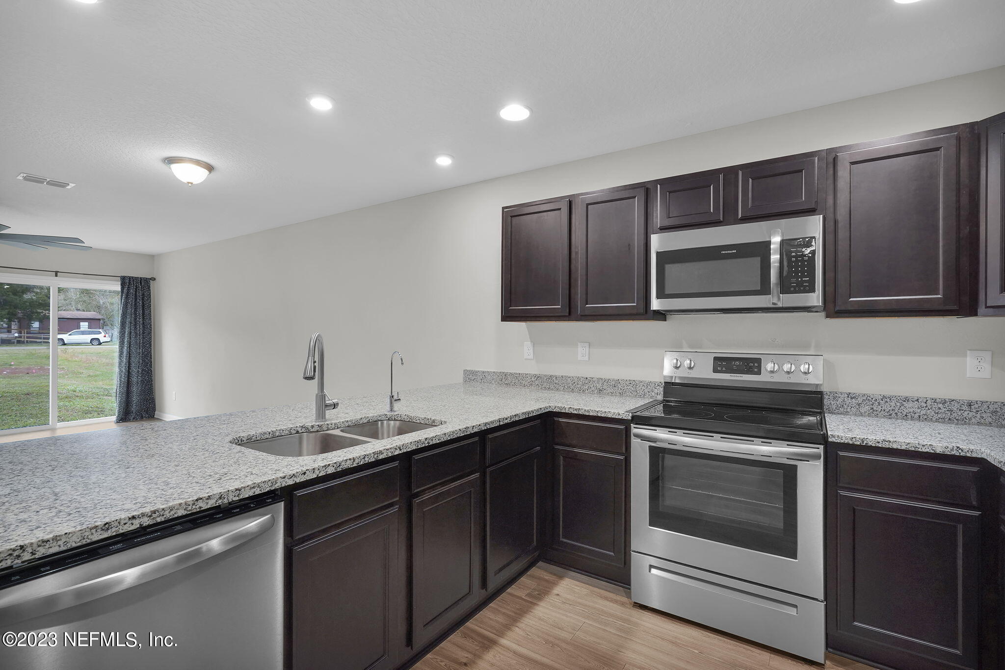 3082 Jennings Road Jacksonville, FL 32218 - Photo 2 of 17 a kitchen with a sink stove and microwave