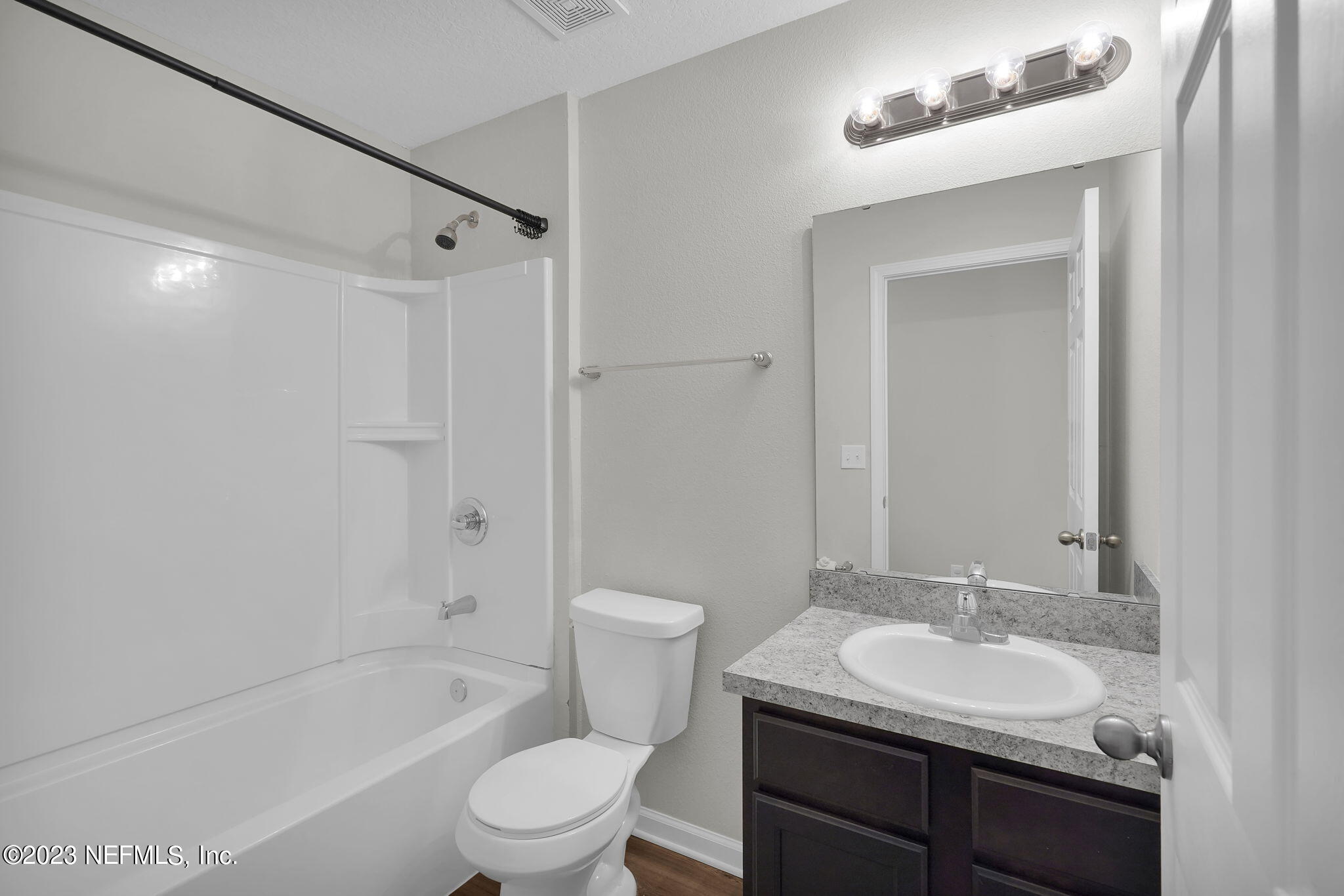 3082 Jennings Road Jacksonville, FL 32218 - Photo 8 of 17 a bathroom with a sink toilet tub and shower
