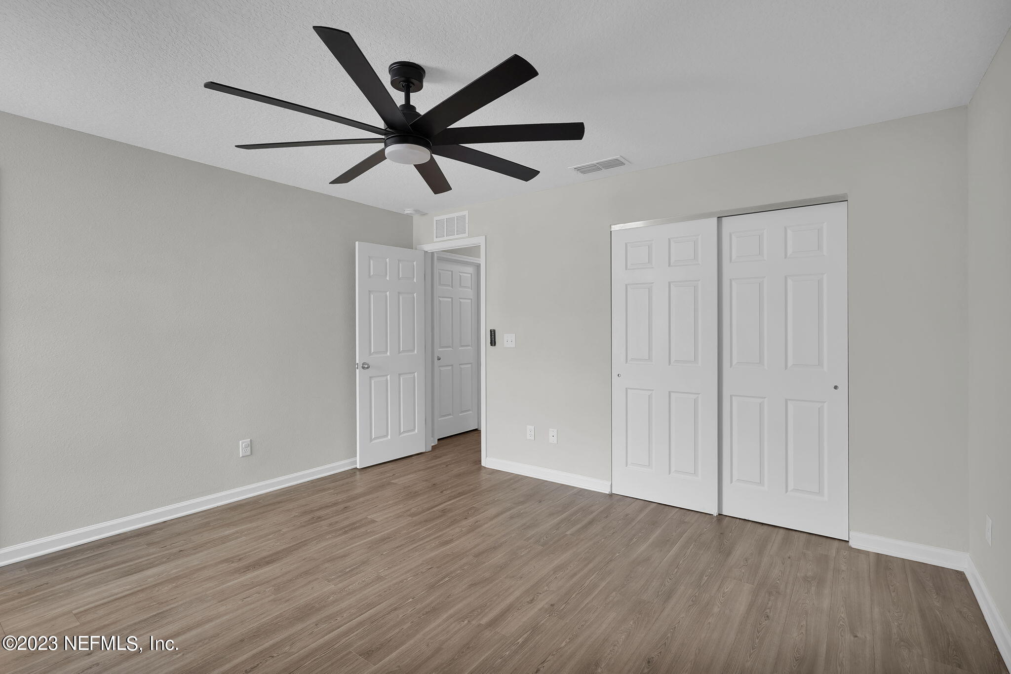 3082 Jennings Road Jacksonville, FL 32218 - Photo 9 of 17 a view of an empty room with wooden floor