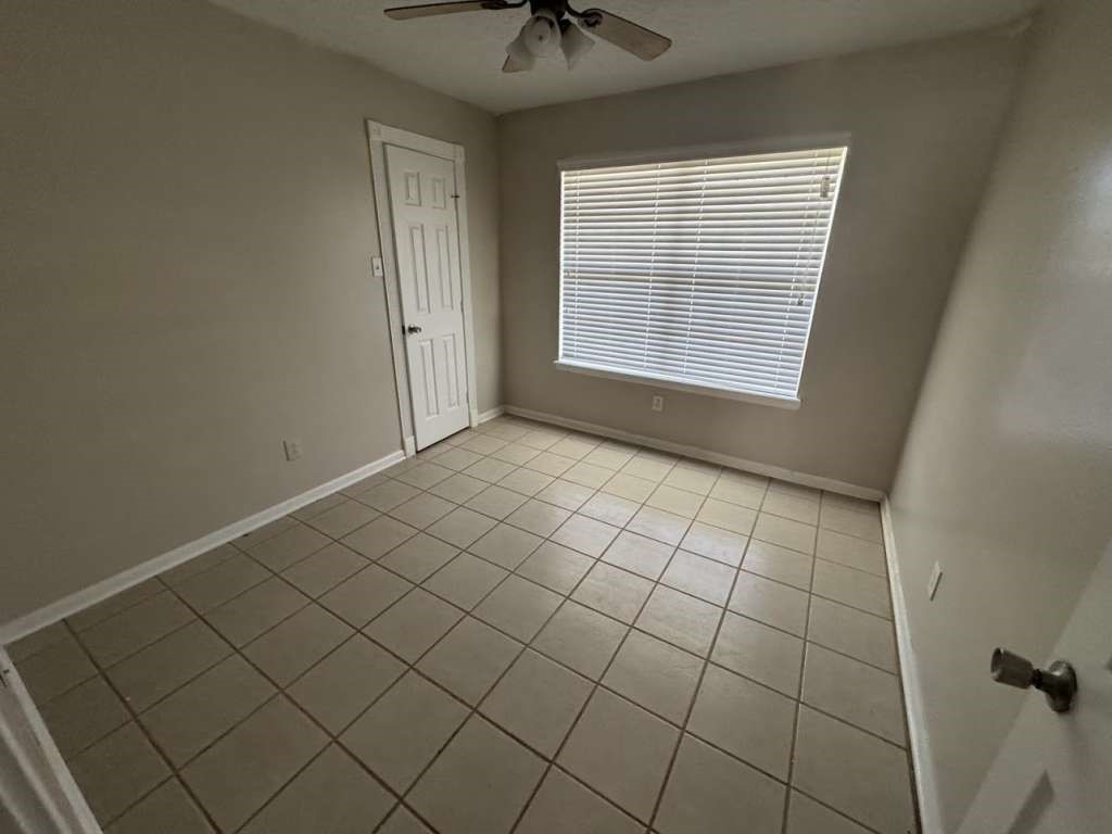 3 John Kay Road Huntsville, TX 77320 - Photo 13 of 23 a view of an empty room with a window