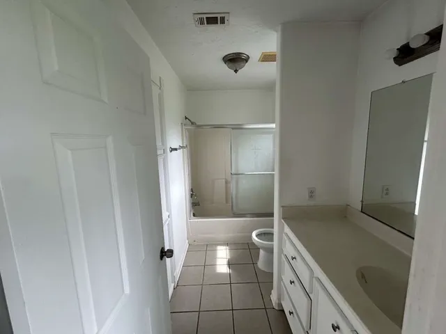 a bathroom with a tub and a shower