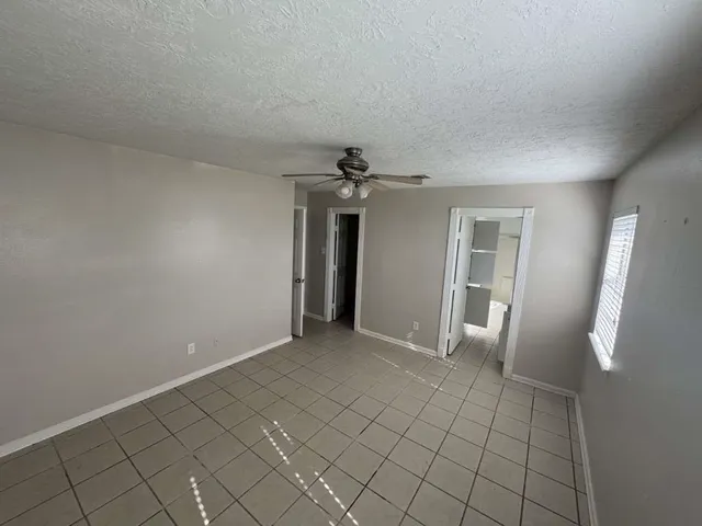 a view of an empty room with glass door