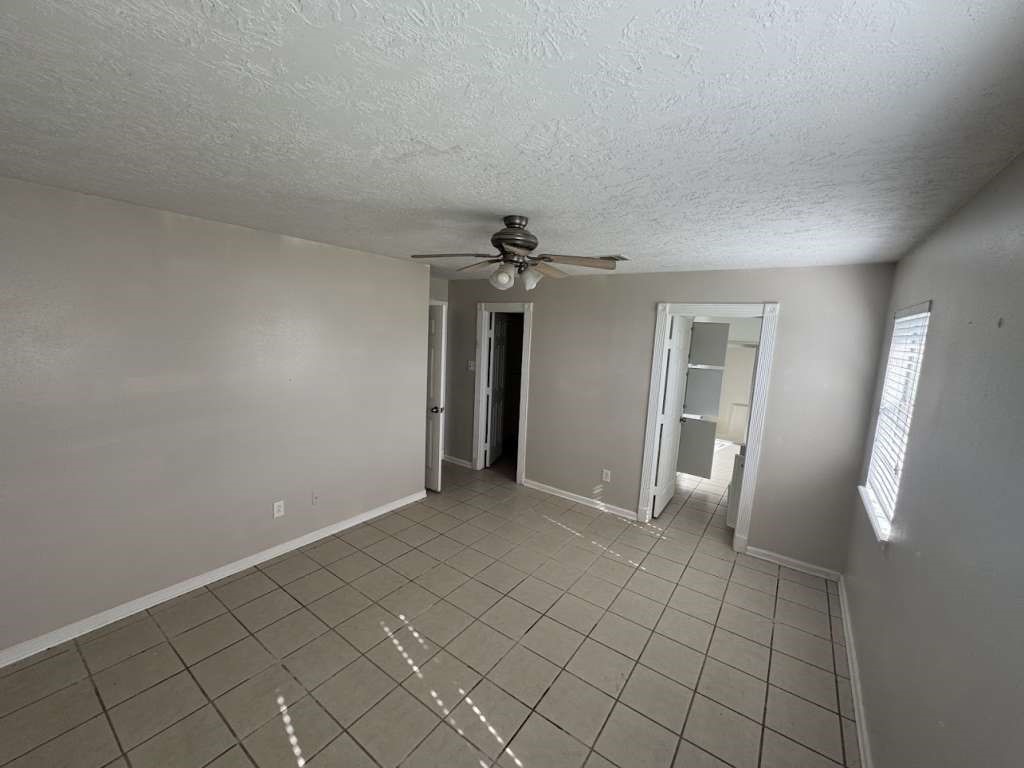 3 John Kay Road Huntsville, TX 77320 - Photo 18 of 23 a view of an empty room with glass door