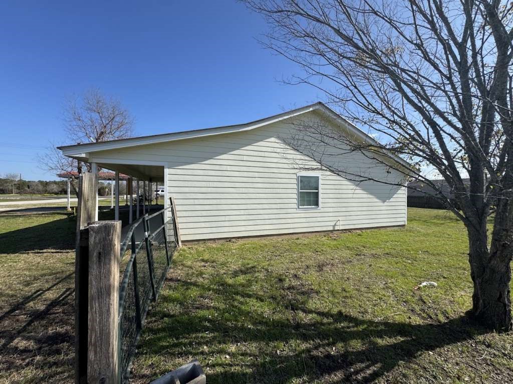 3 John Kay Road Huntsville, TX 77320 - Photo 20 of 23 a backyard of a house with lots of green space