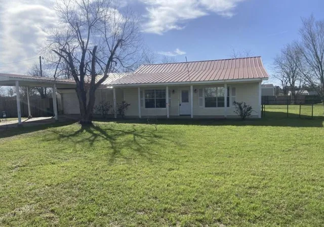 a front view of house with yard