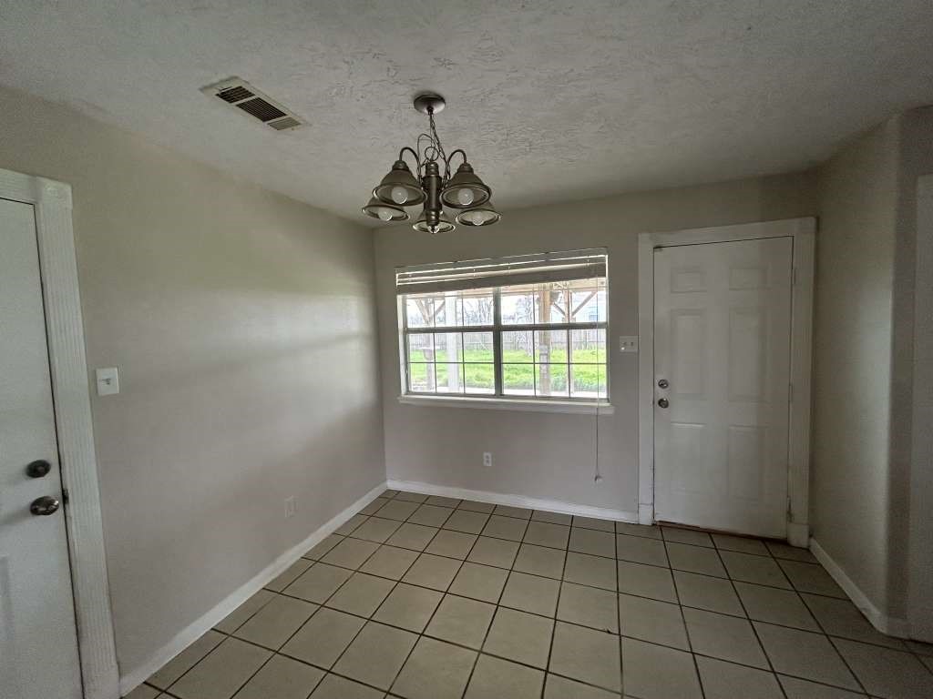 3 John Kay Road Huntsville, TX 77320 - Photo 7 of 23 a view of an empty room with a window