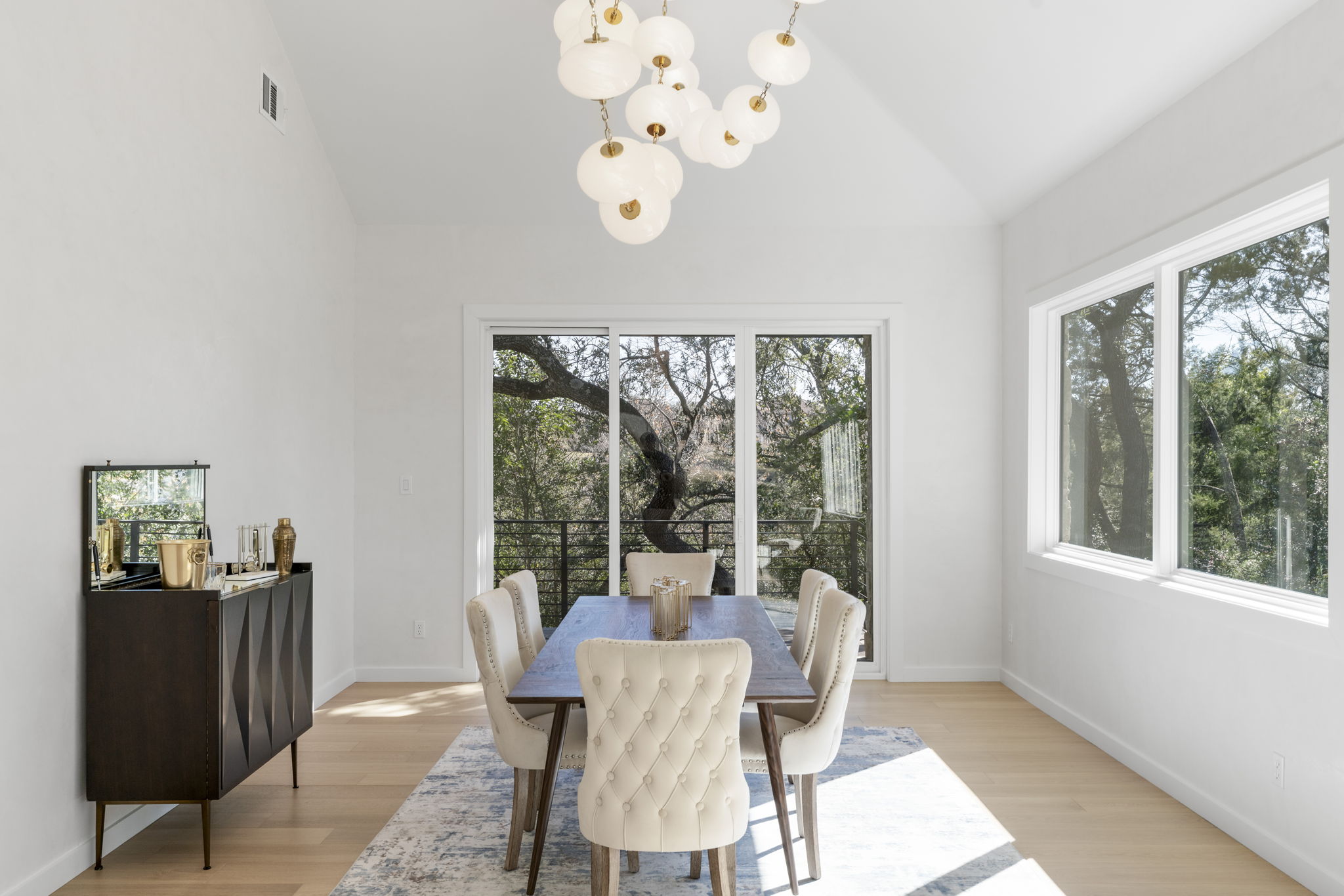 701 Furlong Drive Austin, TX 78746 - Photo 11 of 40 a view of a dining room with furniture window and outside view