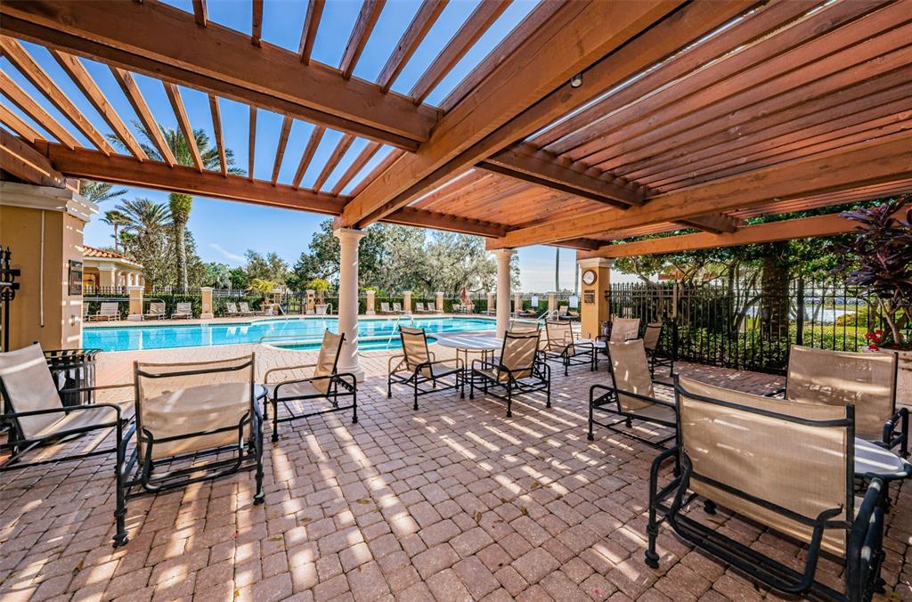 10610 Sabella Drive Trinity, FL 34655 - Photo 41 of 46 a view of a patio with chairs and tables