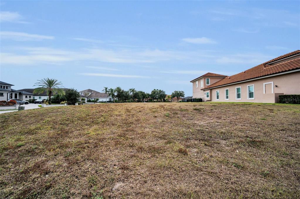 10610 Sabella Drive Trinity, FL 34655 - Photo 9 of 46 a view of a house with a yard and large trees