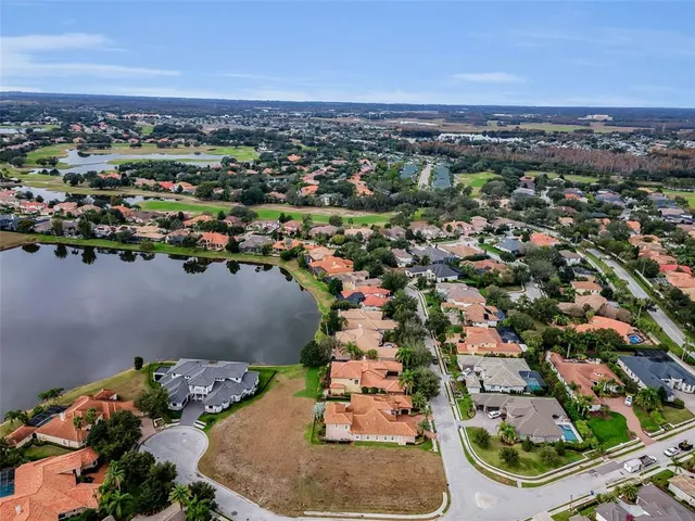 an aerial view of a house with a lake view