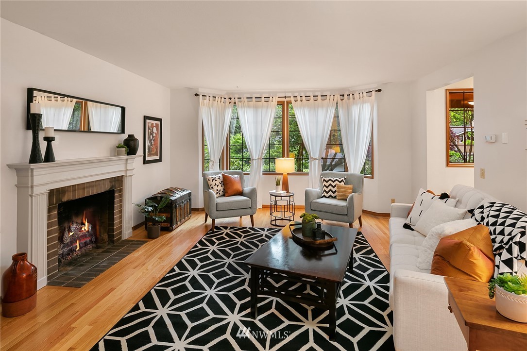 21031 Shell Valley Way Edmonds, WA 98026 - Photo 11 of 32 a living room with furniture fireplace and a large window