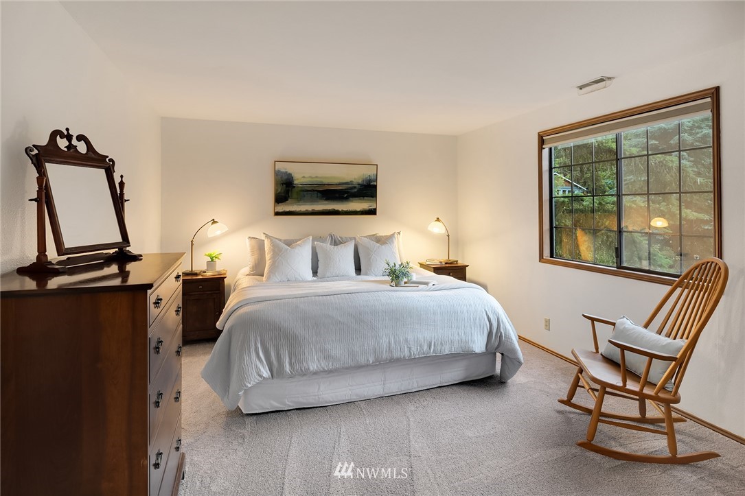 21031 Shell Valley Way Edmonds, WA 98026 - Photo 15 of 32 a bedroom with a bed a window and television