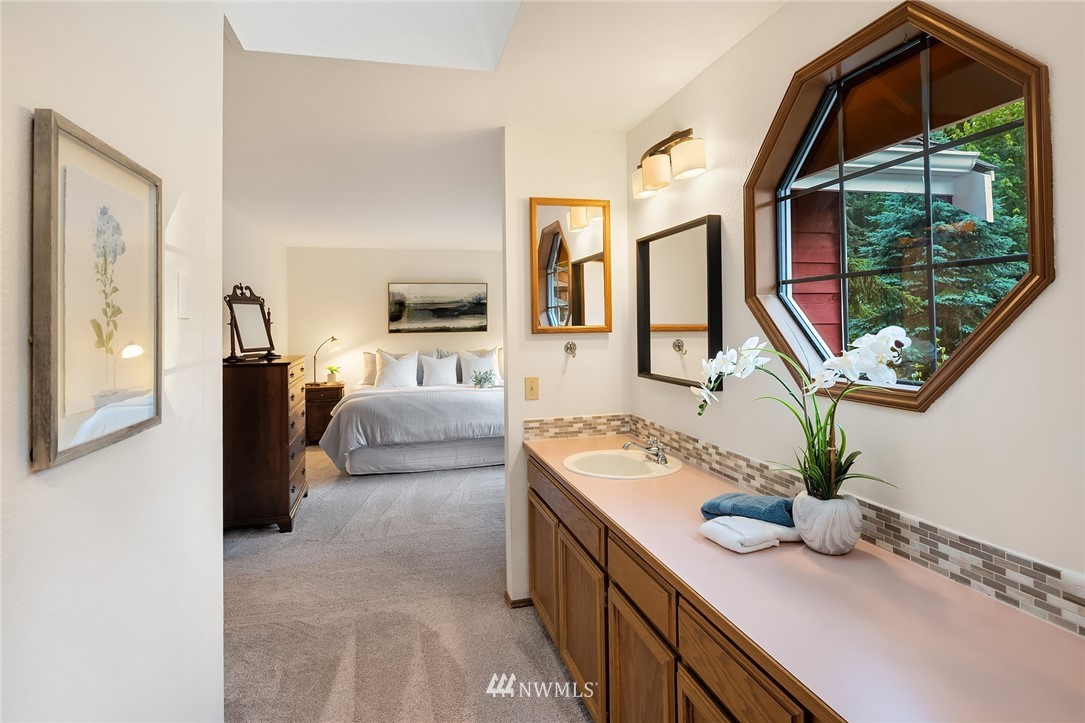 21031 Shell Valley Way Edmonds, WA 98026 - Photo 17 of 32 a en suite bathroom with a double vanity sink and a mirror