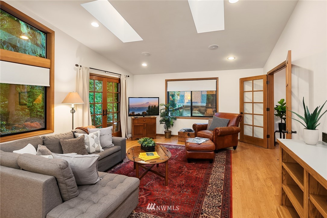 21031 Shell Valley Way Edmonds, WA 98026 - Photo 3 of 32 a living room with furniture fireplace and a flat screen tv