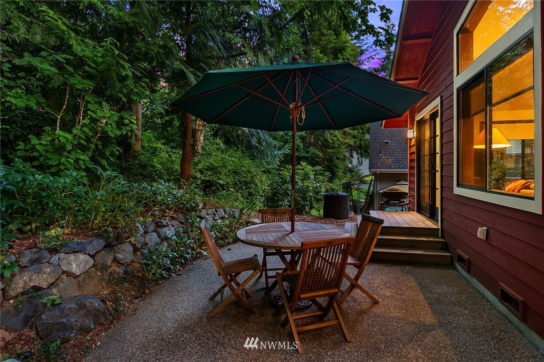 21031 Shell Valley Way Edmonds, WA 98026 - Photo 24 of 32 a view of patio with chairs and table under an umbrella