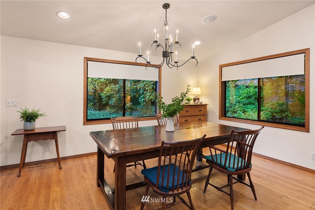 21031 Shell Valley Way Edmonds, WA 98026 - Photo 5 of 32 a view of a dining room with furniture window and wooden floor