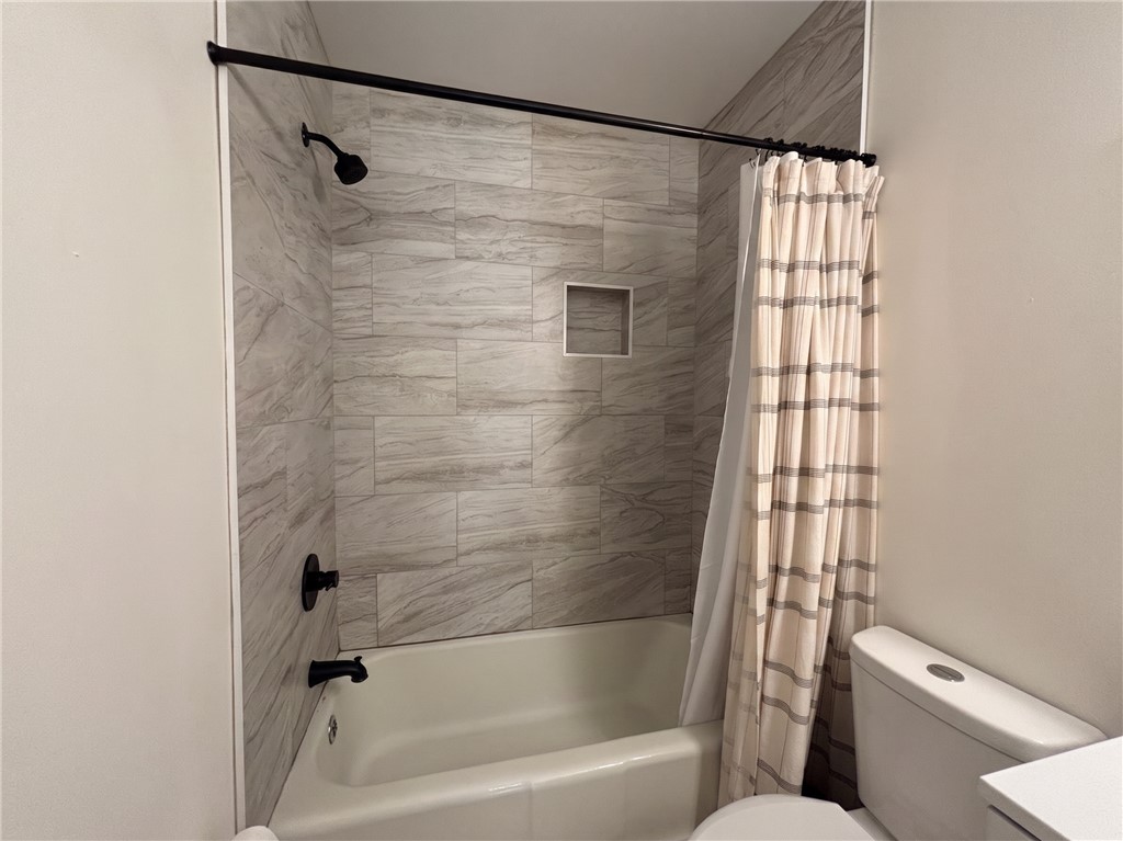 710 O Neal Street Belton, SC 29627 - Photo 14 of 18 Clean lines and tiled walls define this functional and fresh full bathroom.