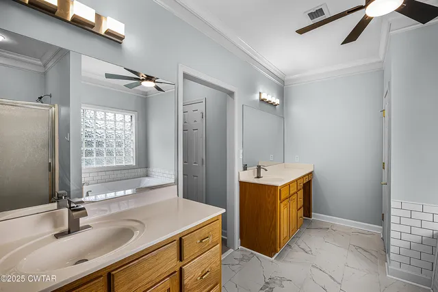 a bathroom with a sink double vanity and a mirror