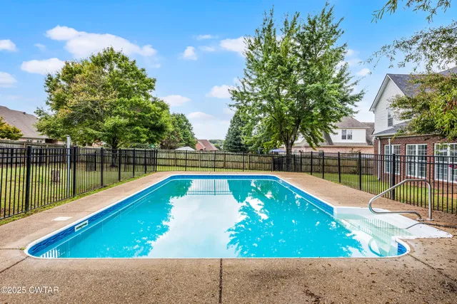 a view of a backyard with a lake view
