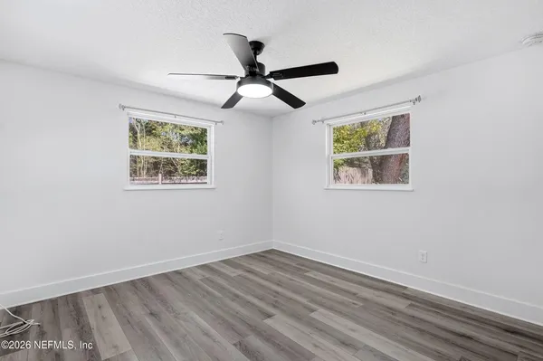 a view of a livingroom with wooden floor