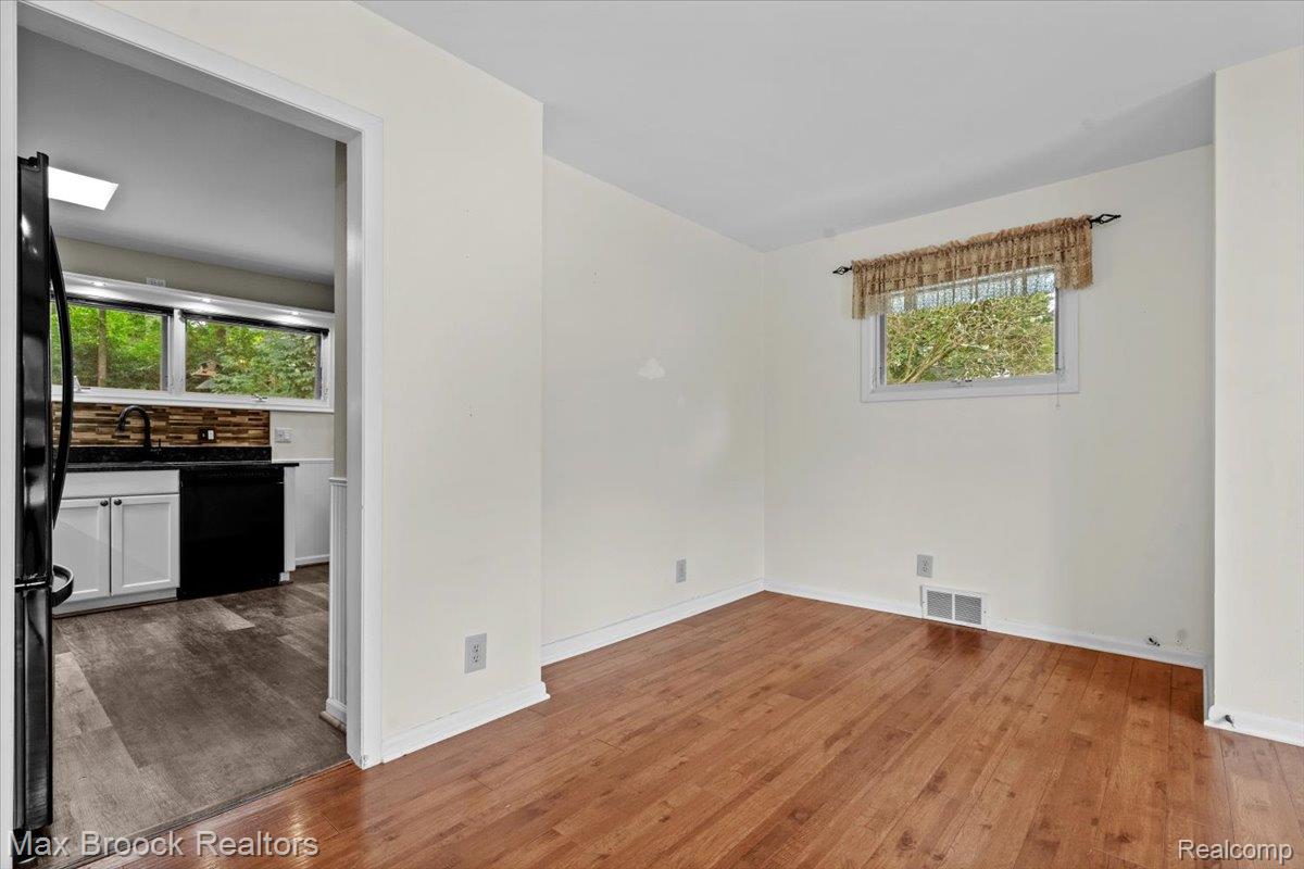 1330 Oak Street Rochester, MI 48307 - Photo 5 of 35 Warm wood-finish flooring complements the light wall tones