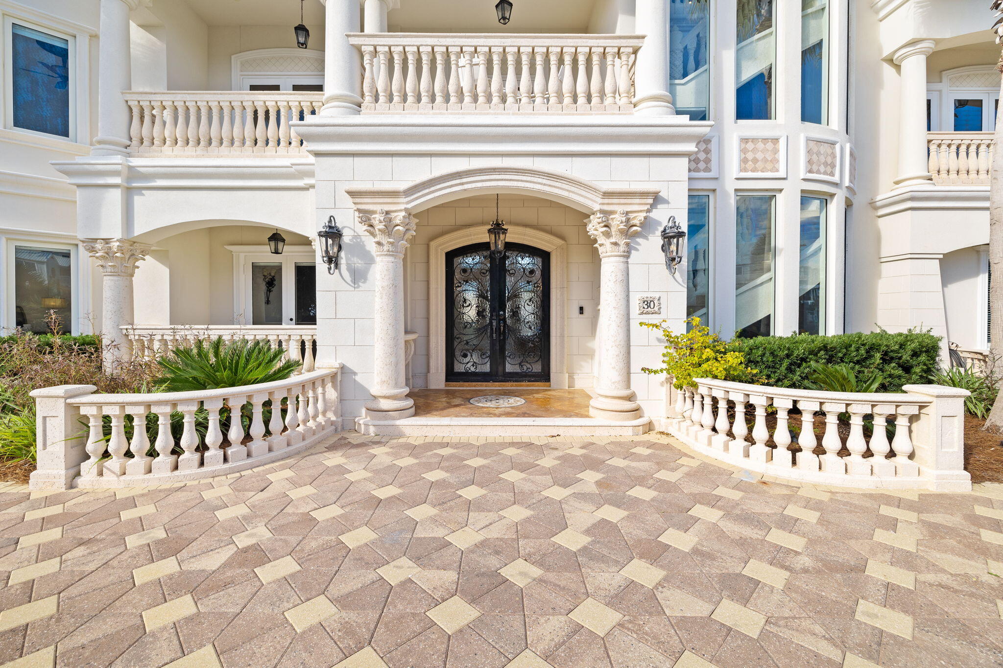 30 Pelican Circle Inlet Beach, FL 32461 - Photo 64 of 69 a view of a brick house with large windows and a gate