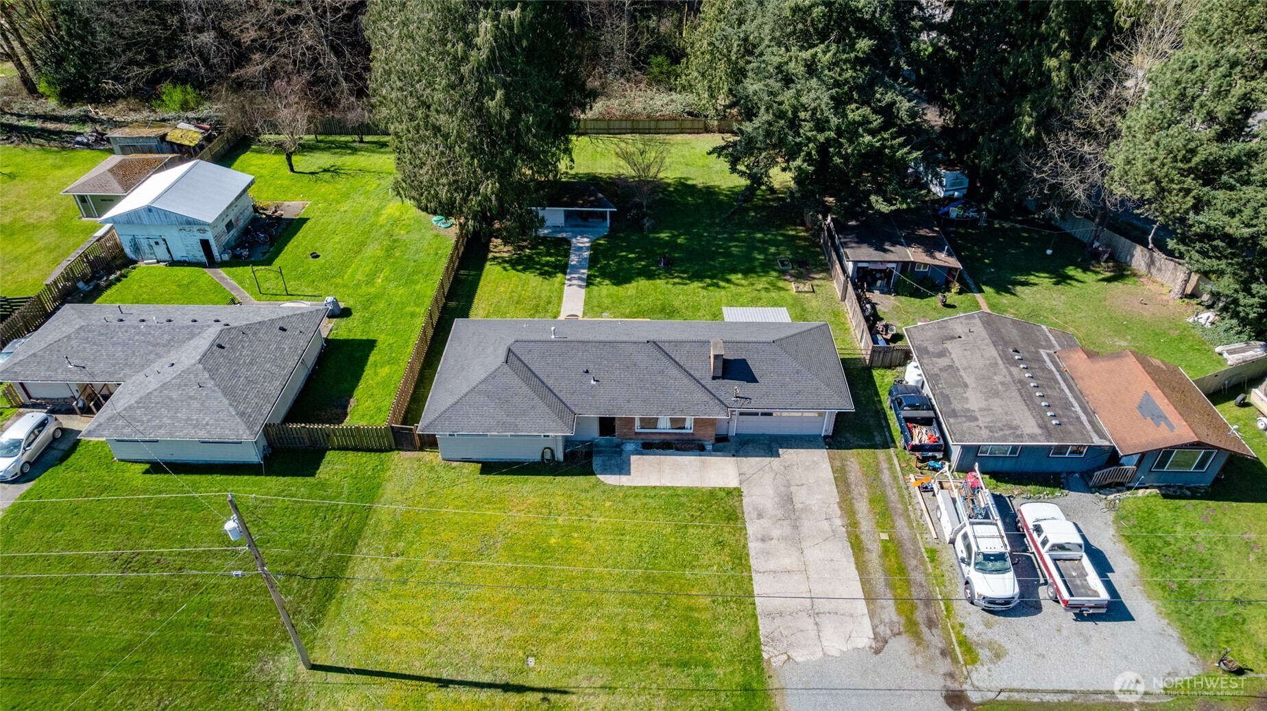 an aerial view of a house with a garden and swimming pool