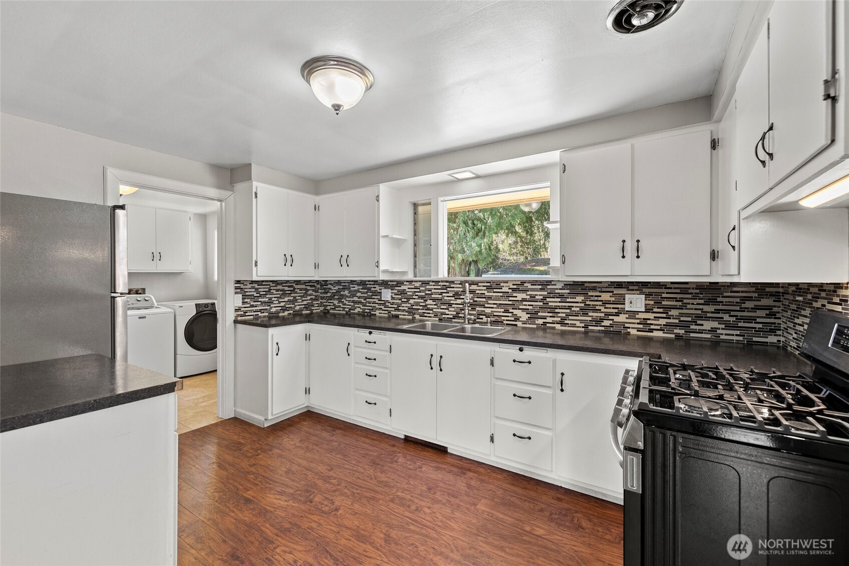 10450 Sterling Road Sedro-Woolley, WA 98284 - Photo 17 of 33 a kitchen with granite countertop a stove and a sink