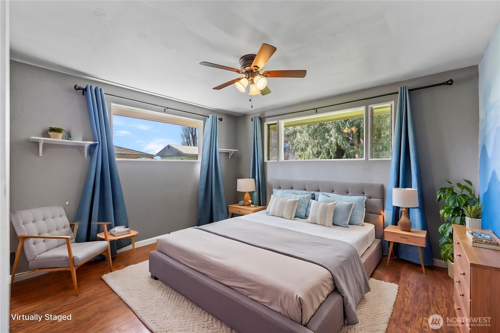 10450 Sterling Road Sedro-Woolley, WA 98284 - Photo 24 of 33 a bedroom with a bed and a chandelier