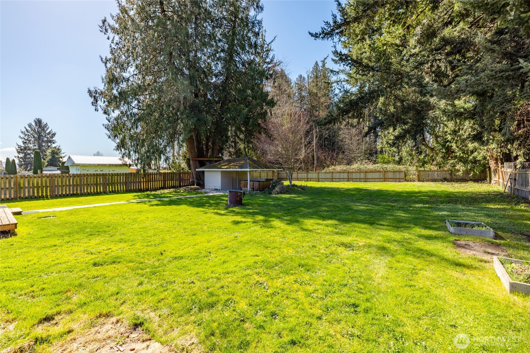 10450 Sterling Road Sedro-Woolley, WA 98284 - Photo 32 of 33 a view of a swimming pool with a garden and trees