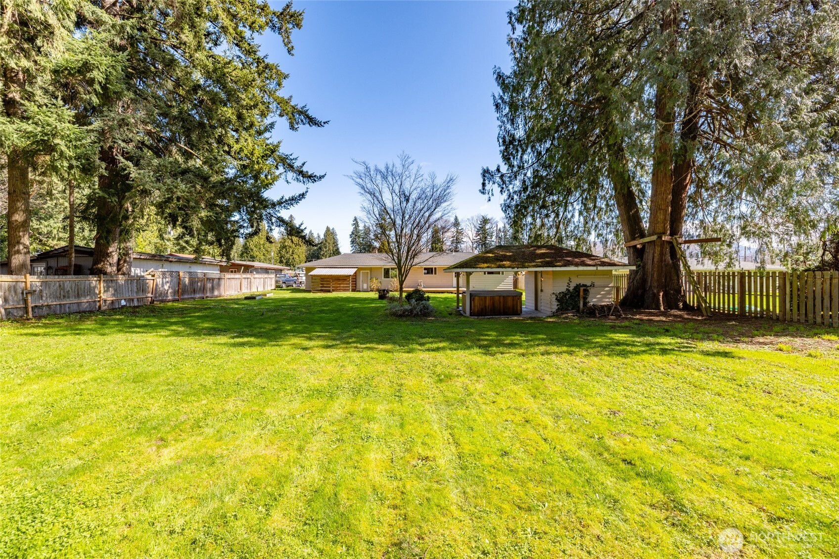 10450 Sterling Road Sedro-Woolley, WA 98284 - Photo 7 of 33 a front view of a house with swimming pool and trees