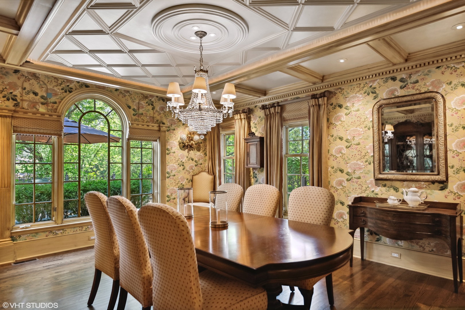 916 Shermer Road Northbrook, IL 60062 - Photo 16 of 54 a view of a dining room with furniture a chandelier and wooden floor