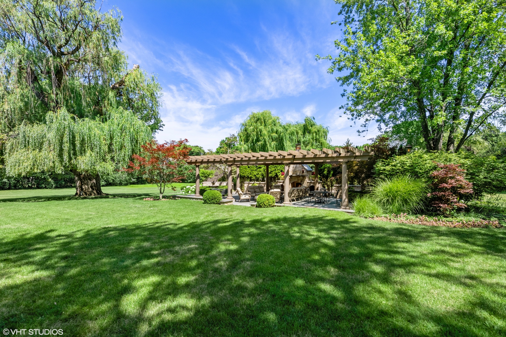 916 Shermer Road Northbrook, IL 60062 - Photo 46 of 54 a view of a backyard with table and chairs and potted plants