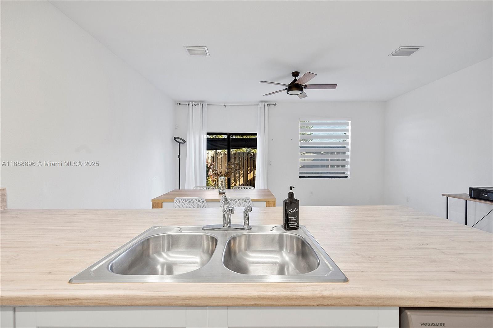 10013 Southwest 228th Terrace, Unit 10013 Miami, FL 33190 - Photo 16 of 39 a kitchen with a sink and a window