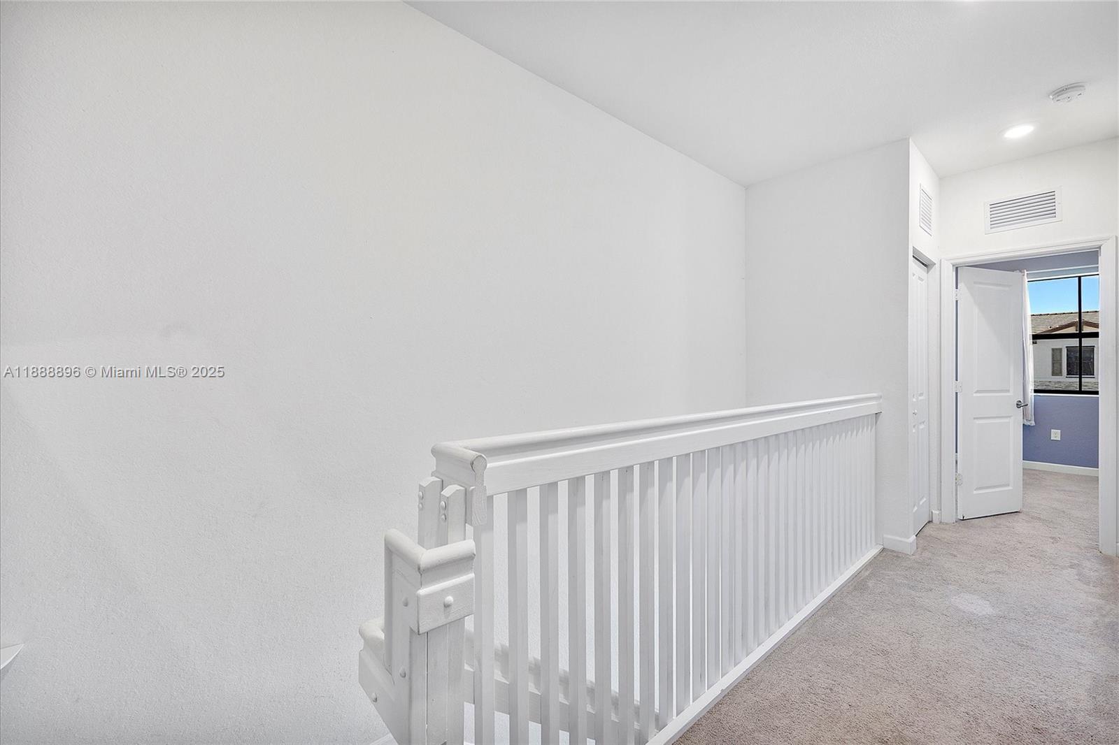 10013 Southwest 228th Terrace, Unit 10013 Miami, FL 33190 - Photo 19 of 39 a view of a hallway