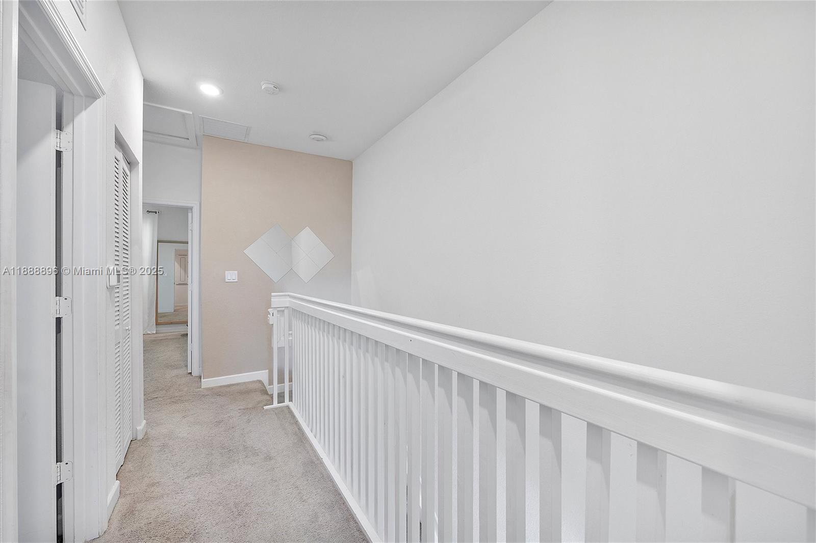 10013 Southwest 228th Terrace, Unit 10013 Miami, FL 33190 - Photo 20 of 39 a view of a hallway with closet area