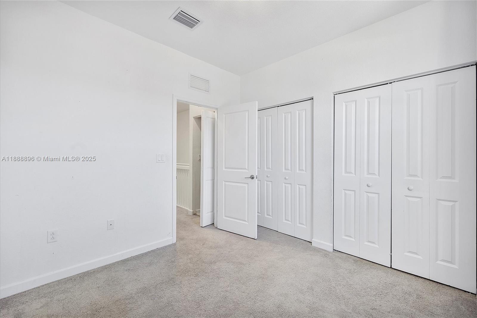 10013 Southwest 228th Terrace, Unit 10013 Miami, FL 33190 - Photo 21 of 39 a view of an empty room