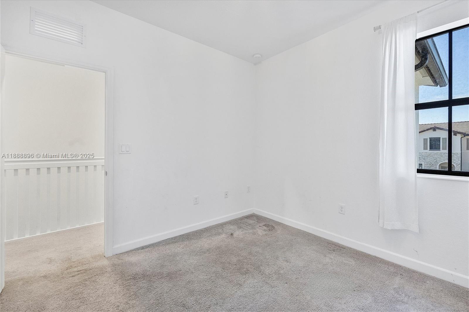 10013 Southwest 228th Terrace, Unit 10013 Miami, FL 33190 - Photo 22 of 39 an empty room with windows