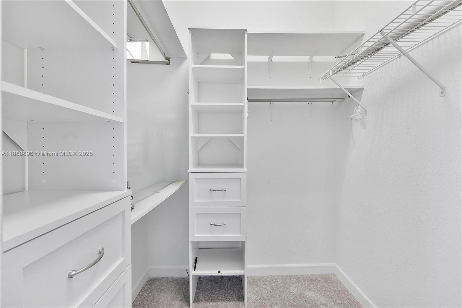 10013 Southwest 228th Terrace, Unit 10013 Miami, FL 33190 - Photo 23 of 39 a view of an empty walk in closet